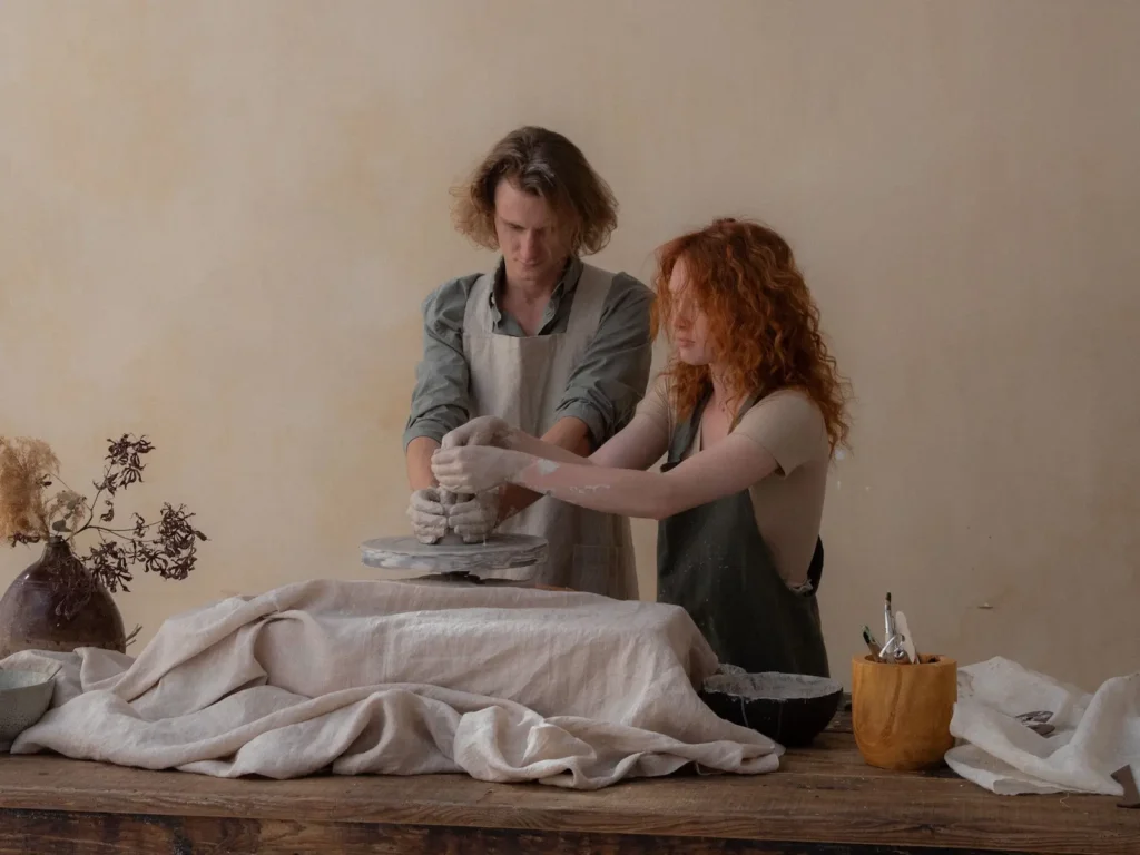 Two people partaking in a custom pottery session
