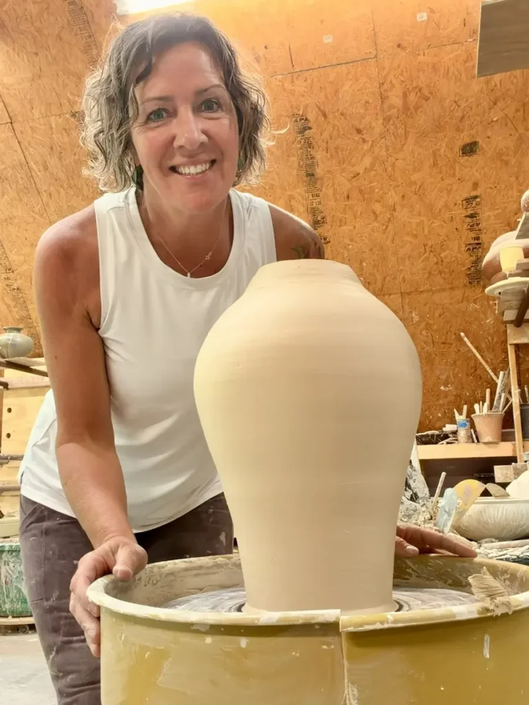 Melanie Tuck pictured with a large vase she just created